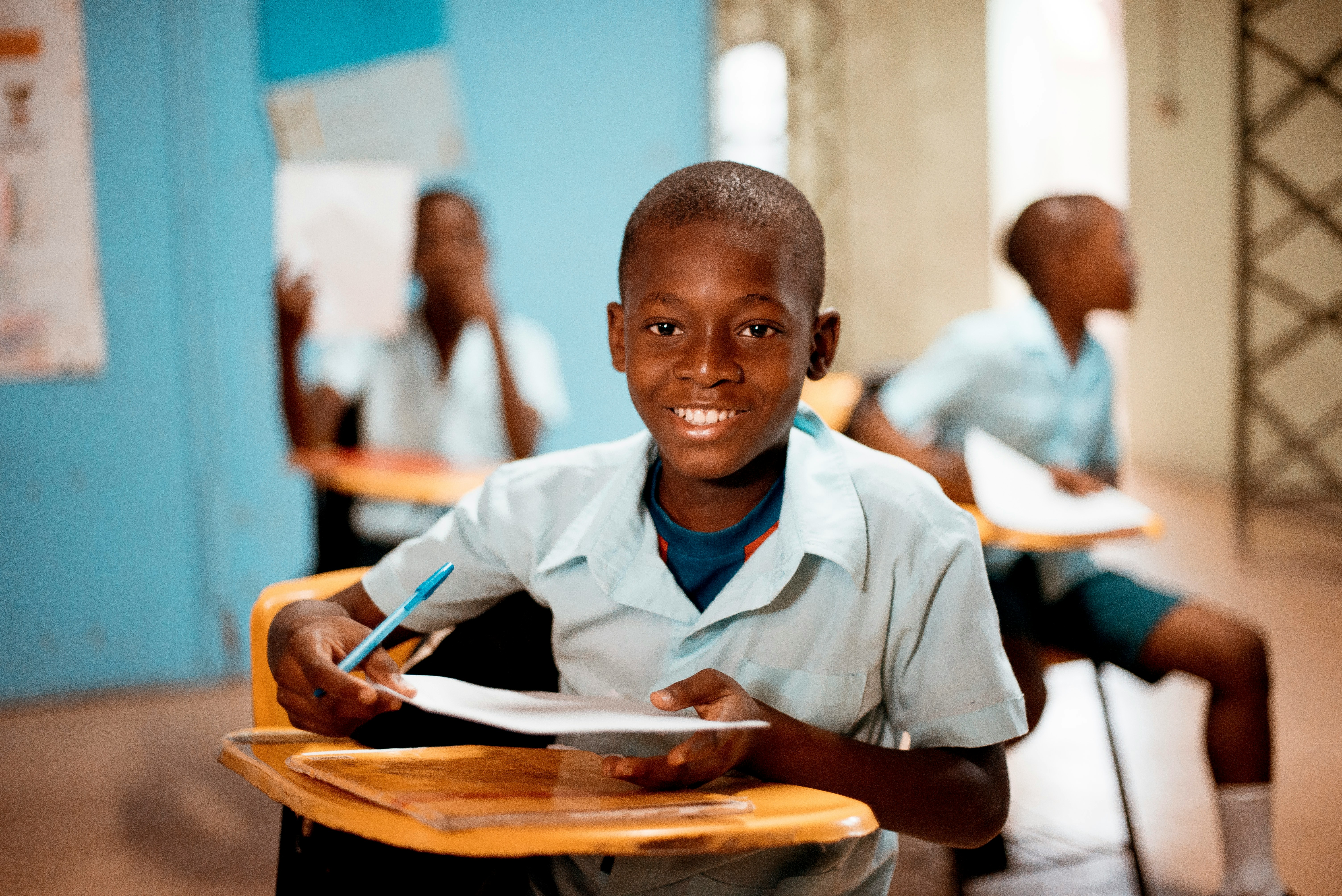 A learner at his desk in class